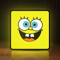 Front view of Spongebob Squarepants LED lightbox sign glowing on a wooden desk