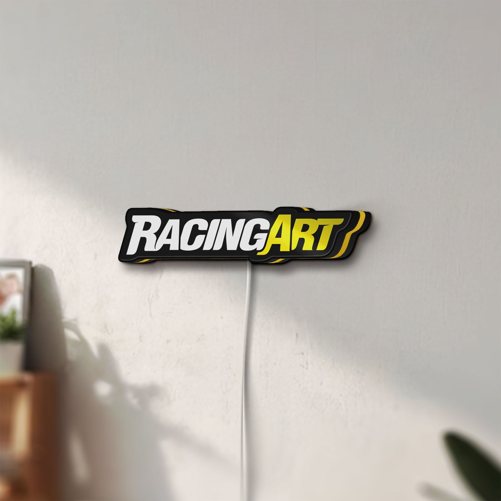 Unlit Racing Art LED lightbox mounted on a wall in daylight