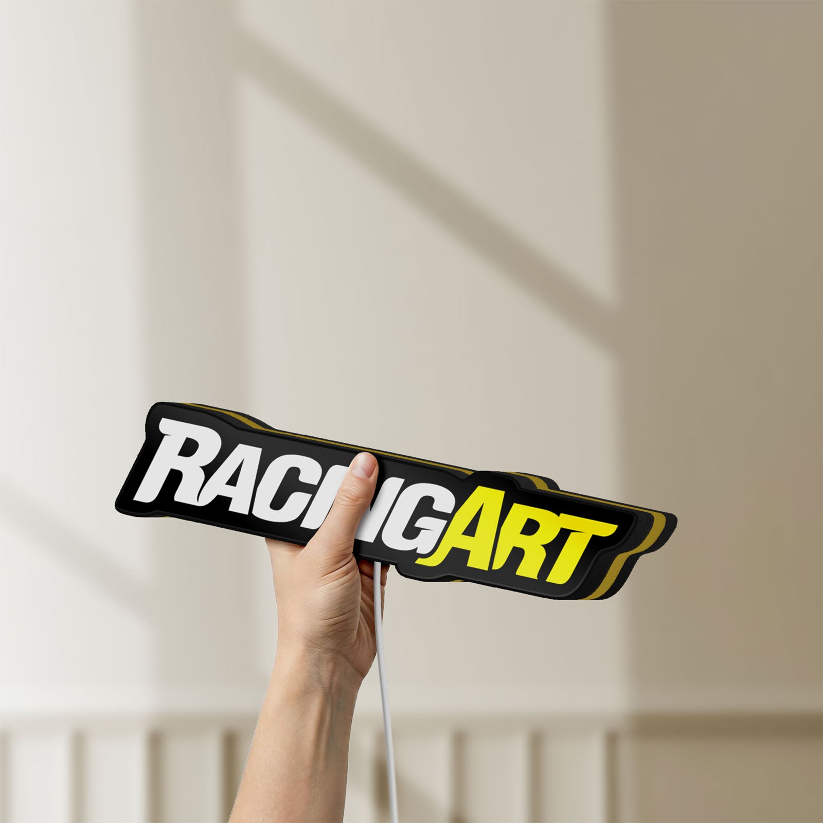 Unlit Racing Art LED lightbox held by hand to show size and details