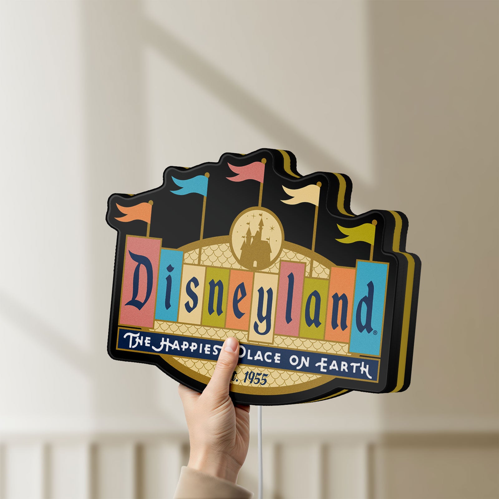 Unlit Disneyland Theme LED lightbox held by hand to show size and details