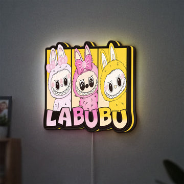 Labubu LED lightbox hanging on a wall with yellow glow