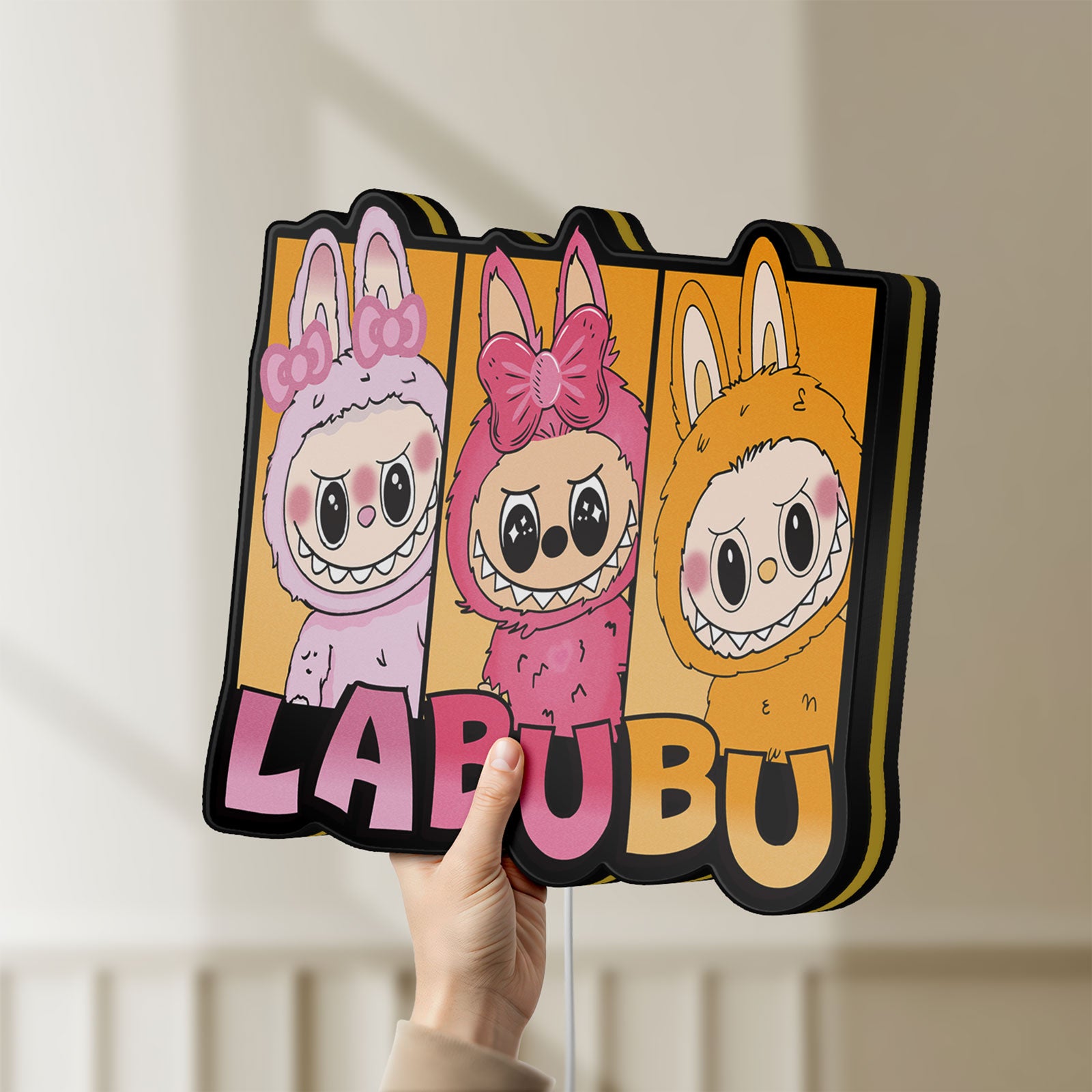 Unlit Labubu LED lightbox held by hand to show size and details