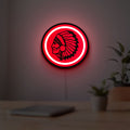 Apache Indian LED lightbox hanging on a room wall with soft red light