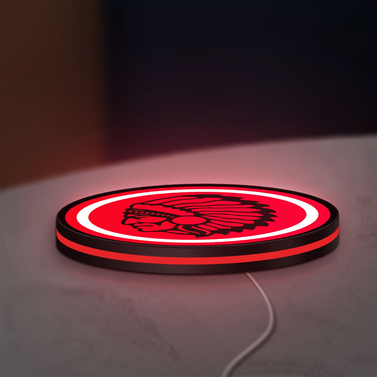 Apache Indian LED lightbox lying flat on a desk with red glow