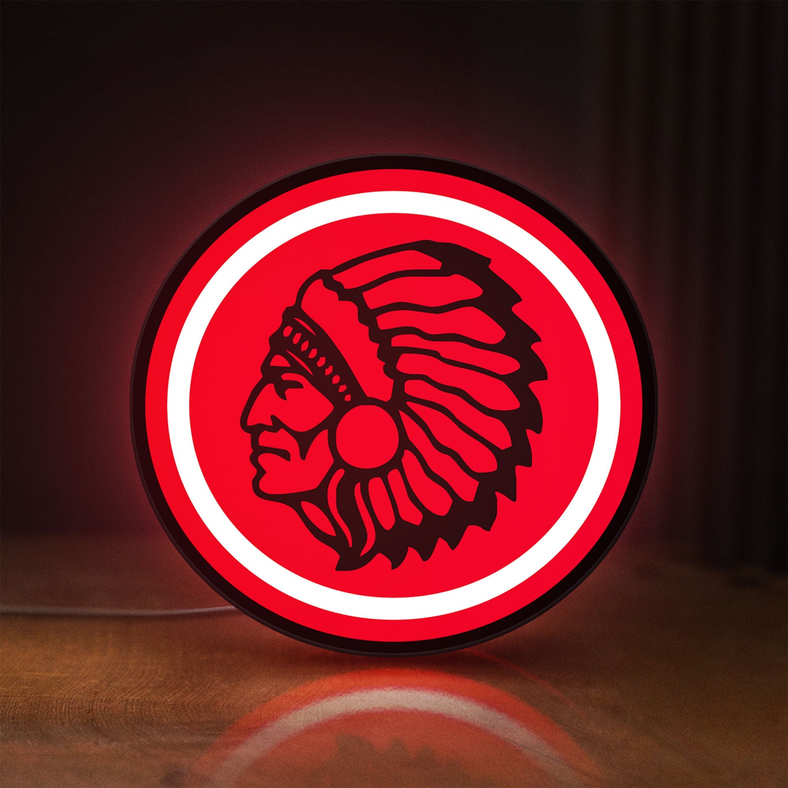 Front view of Apache Indian LED lightbox sign glowing on a wooden desk