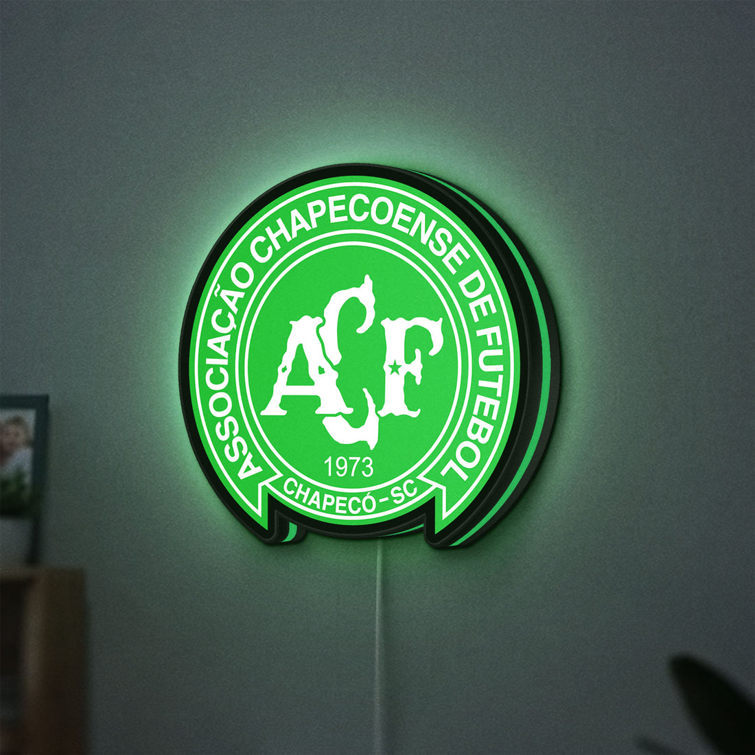Chapecoense 2017 LED lightbox hanging on a wall with green glow