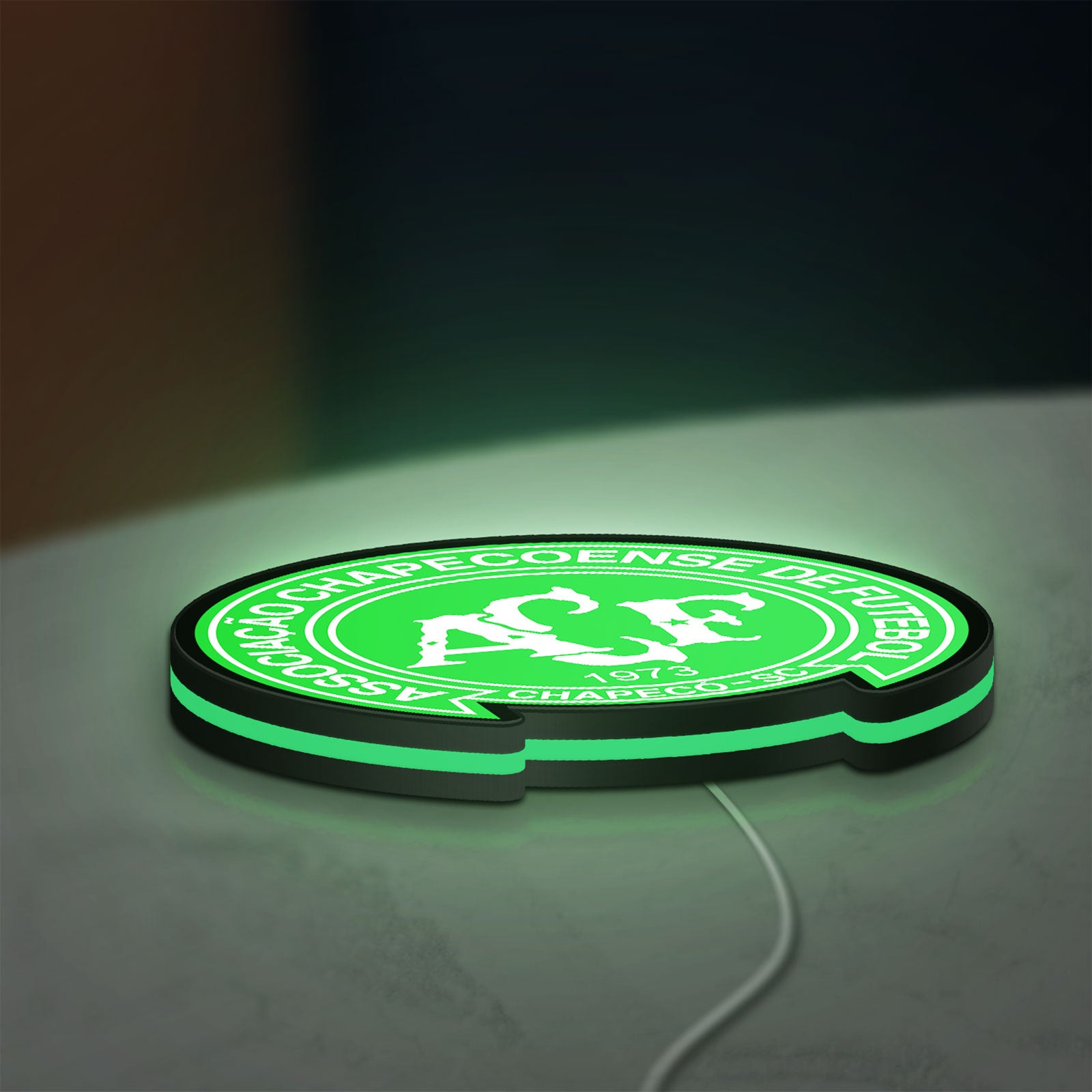 Chapecoense 2017 LED lightbox lying flat on a desk with green glow