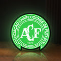 Front view of Chapecoense 2017 LED lightbox sign glowing on a wooden desk