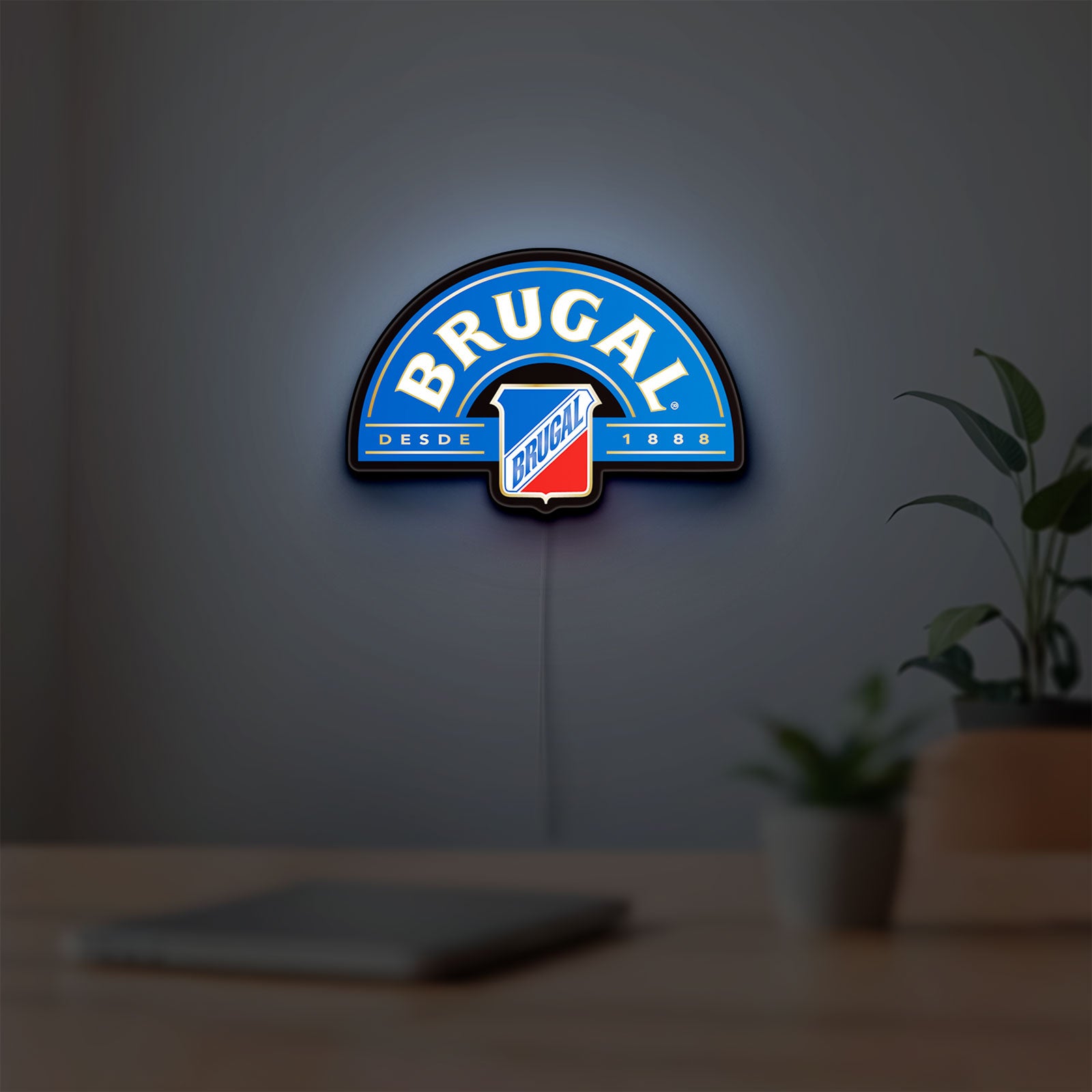 Brugal LED lightbox hanging on a room wall with soft blue light