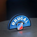 Brugal LED lightbox standing on a desk from an angled side view with blue glow
