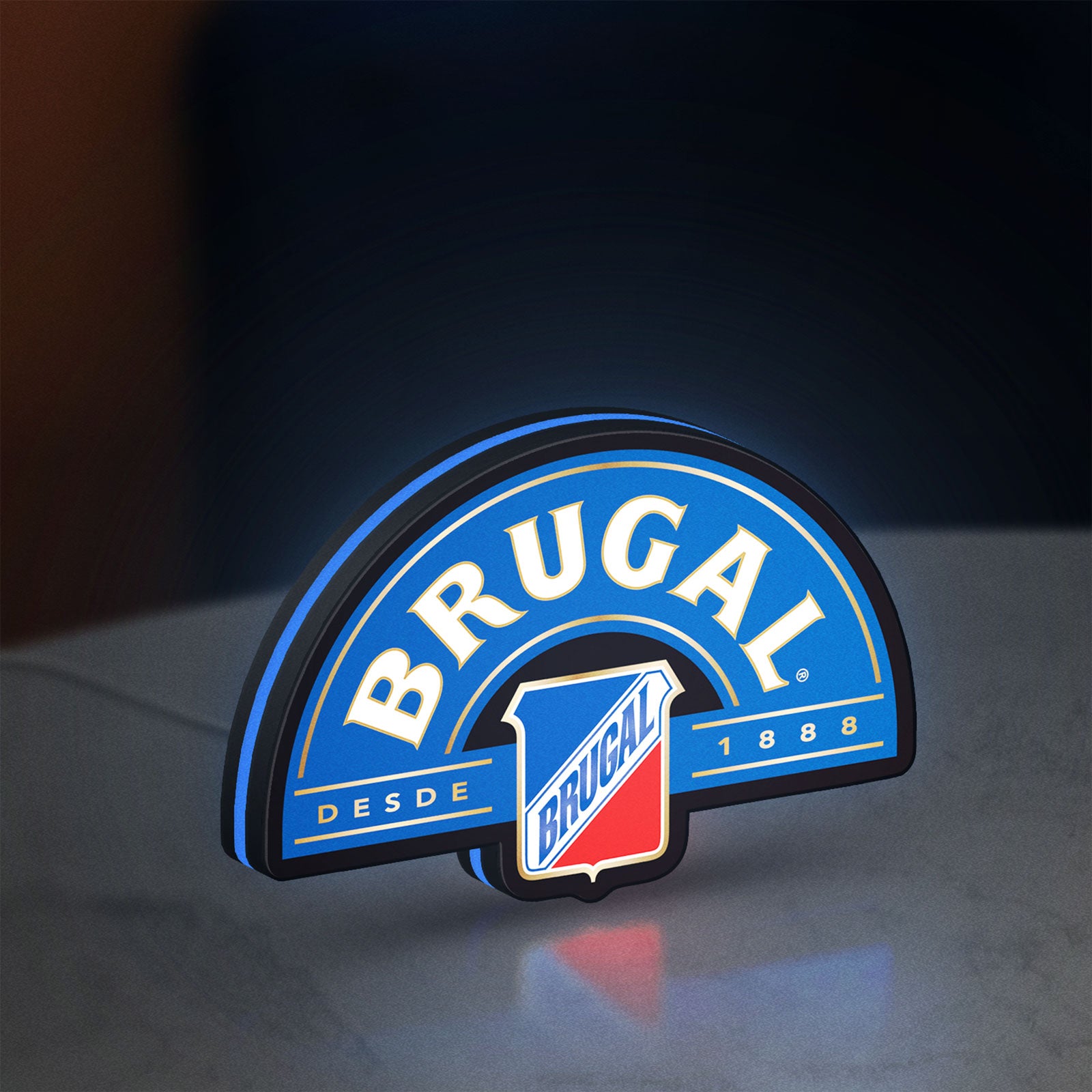 Brugal LED lightbox standing on a desk from an angled side view with blue glow
