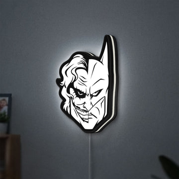 Joker LED lightbox hanging on a wall with white glow