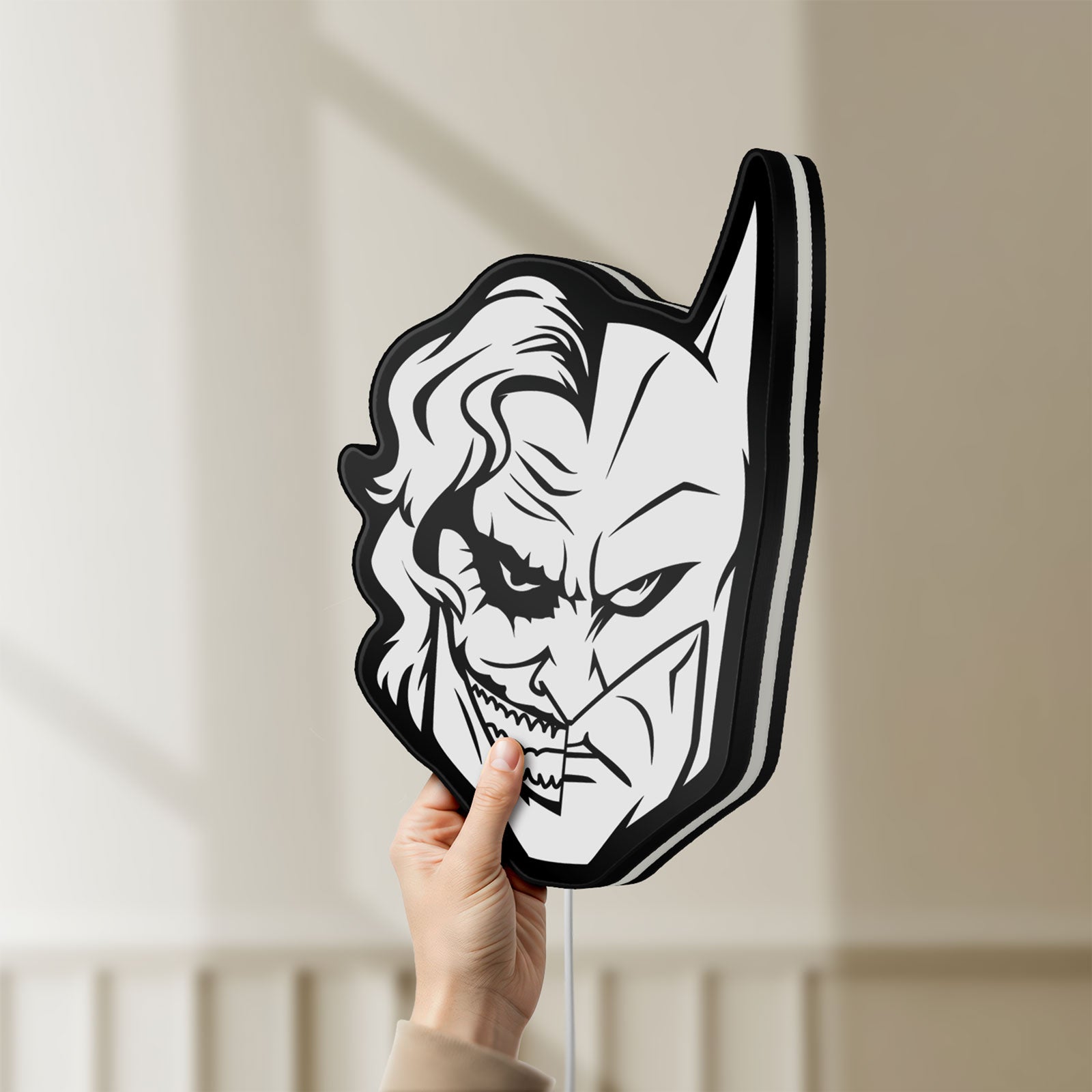 Unlit Joker LED lightbox held by hand to show size and details