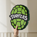 Unlit Teenage Mutant Ninja Turtles LED lightbox held by hand to show size and details