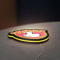Mickey Mouse LED lightbox lying flat on a desk with yellow glow
