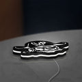 Straw Hat Pirates LED lightbox lying flat on a desk with white glow