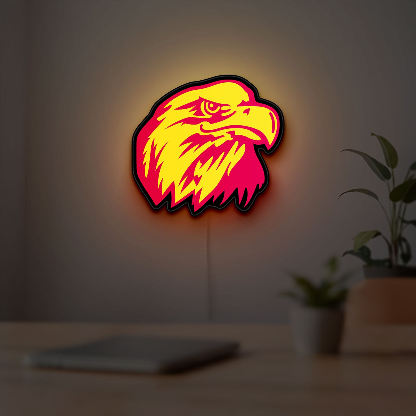 Eagle Head LED lightbox hanging on a room wall with soft yellow light