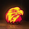 Front view of Eagle Head LED lightbox sign glowing on a wooden desk