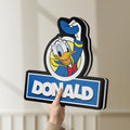 Unlit Donald LED lightbox held by hand to show size and details