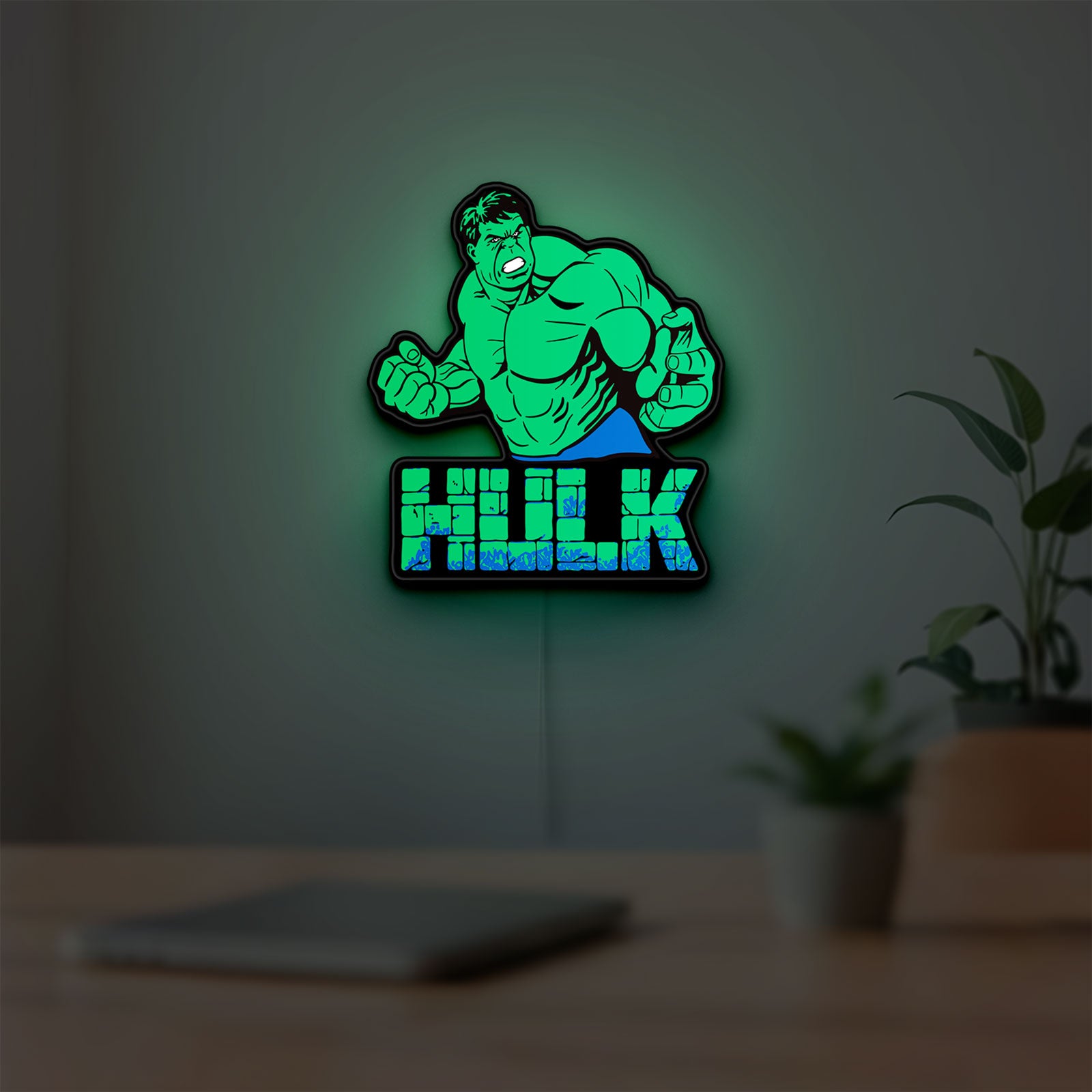 Hulk LED lightbox hanging on a room wall with soft green light