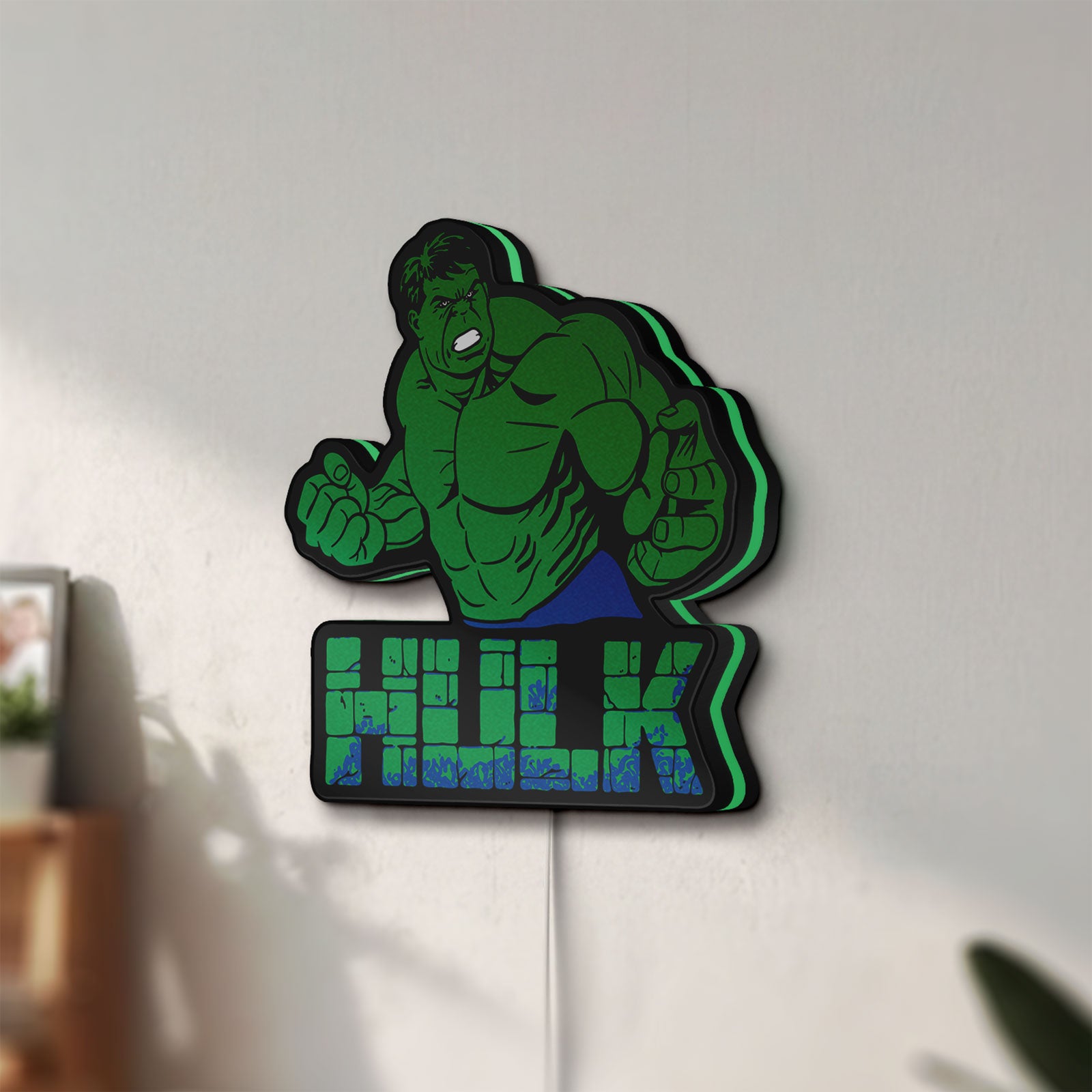 Unlit Hulk LED lightbox mounted on a wall in daylight