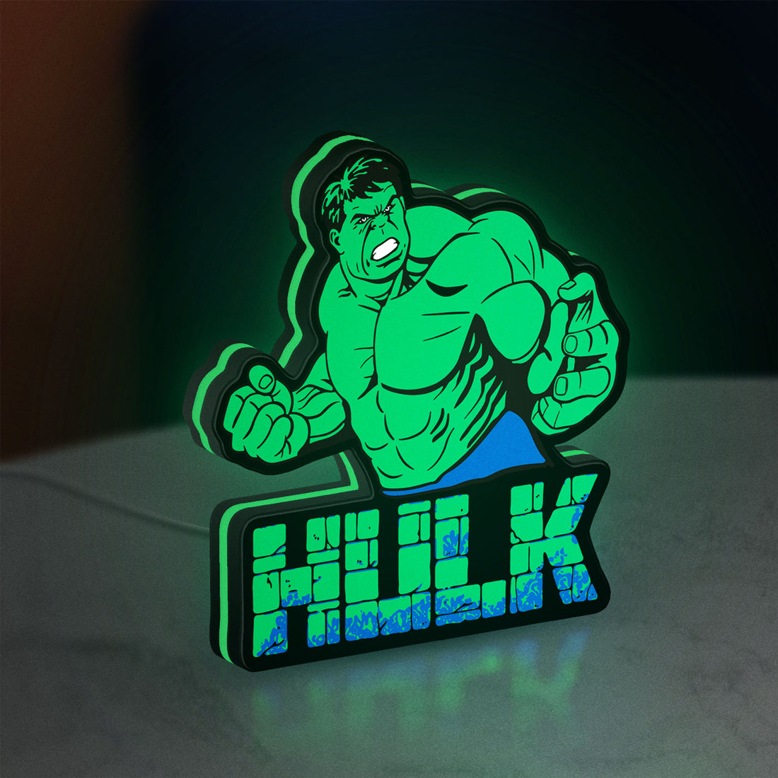 Hulk LED lightbox hanging on a wall with green glow