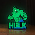 Front view of Hulk LED lightbox sign glowing on a wooden desk