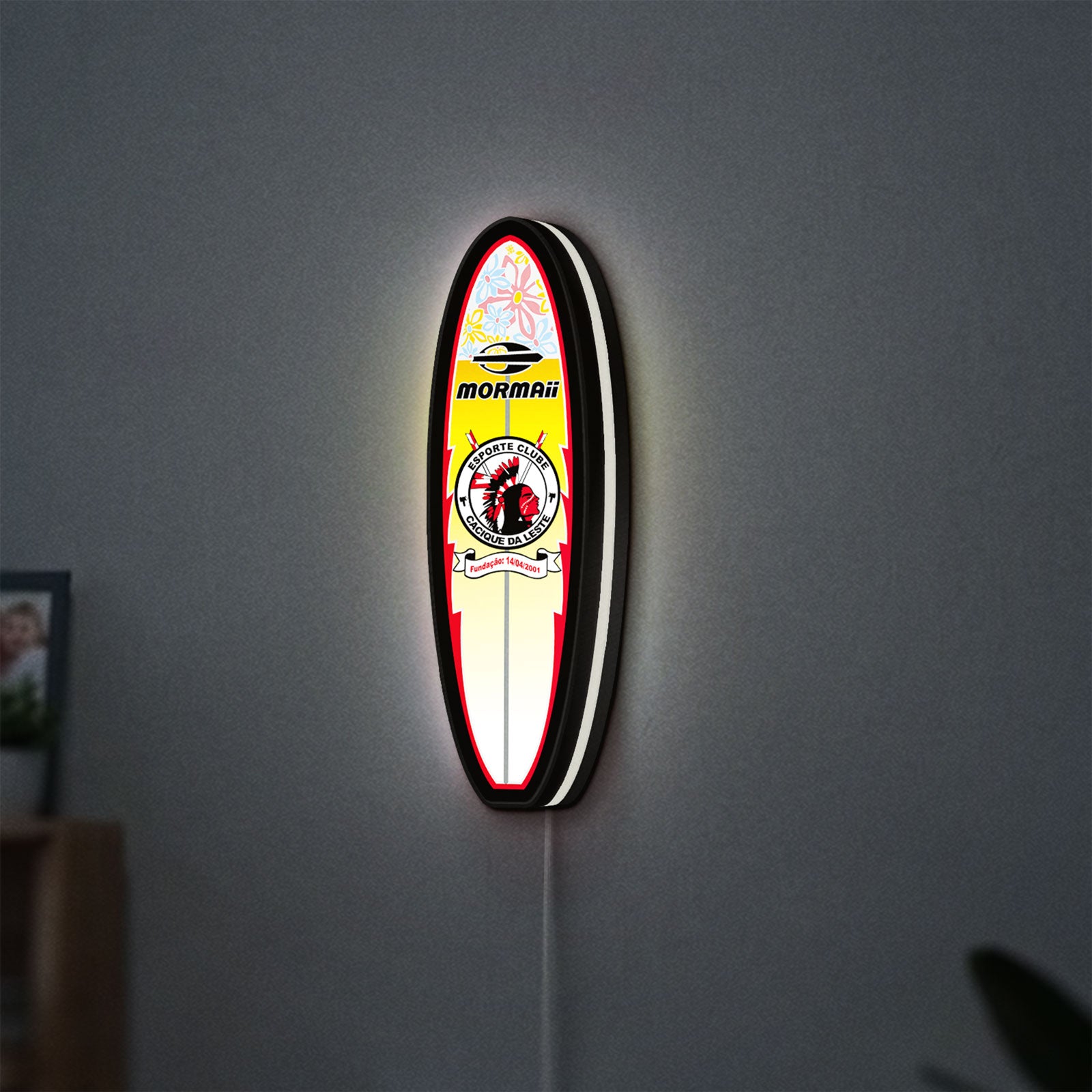 Mormai Surf LED lightbox hanging on a wall with white glow