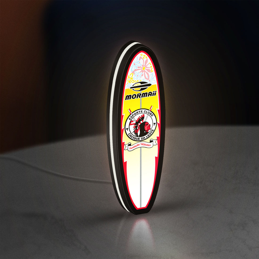 Mormai Surf LED lightbox hanging on a wall with white glow