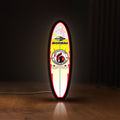 Front view of Mormai Surf LED lightbox sign glowing on a wooden desk