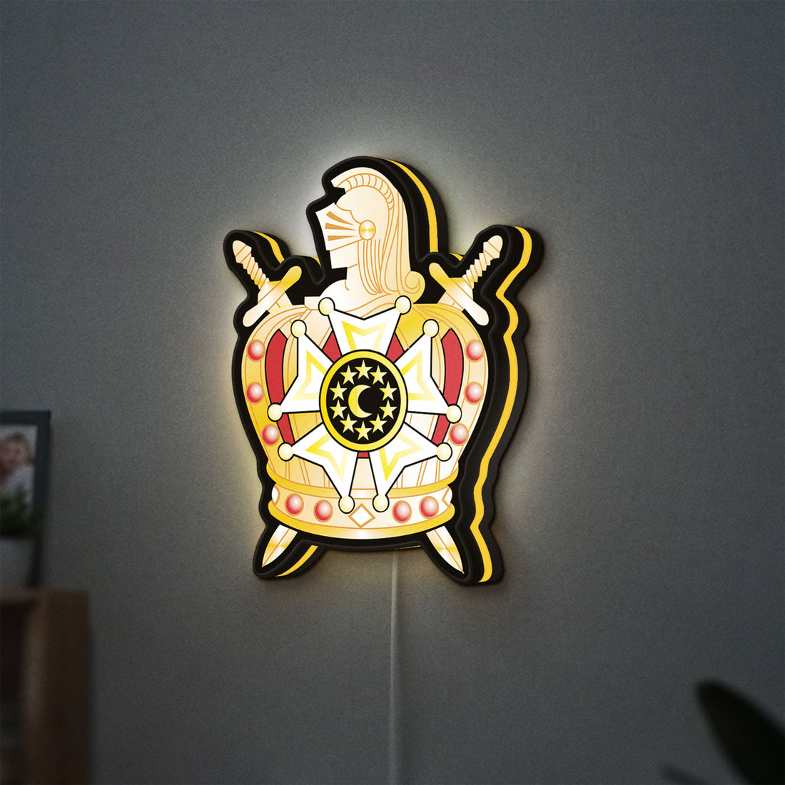 Ordem Demolay LED lightbox hanging on a wall with yellow glow