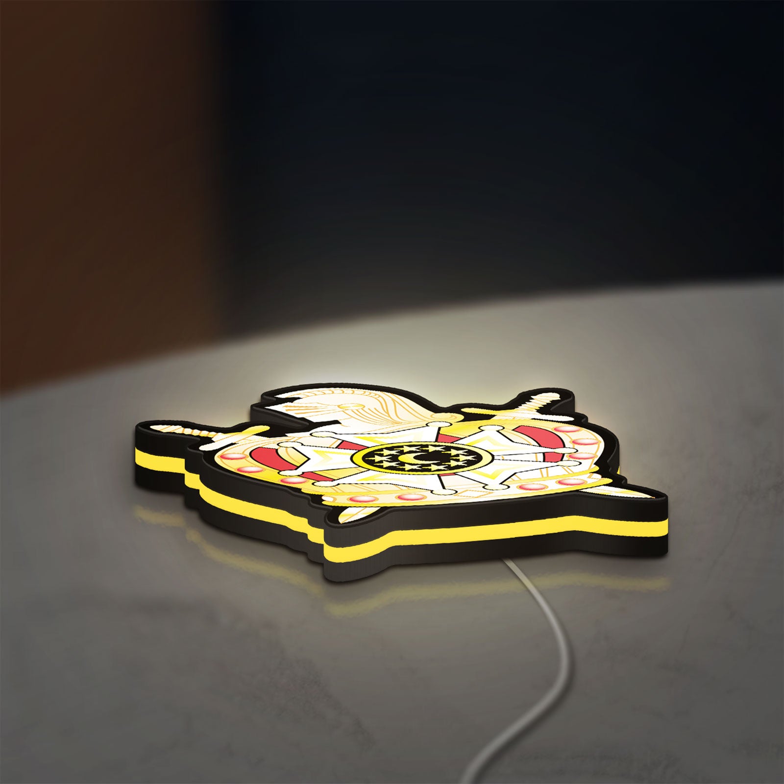 Ordem Demolay LED lightbox lying flat on a desk with yellow glow