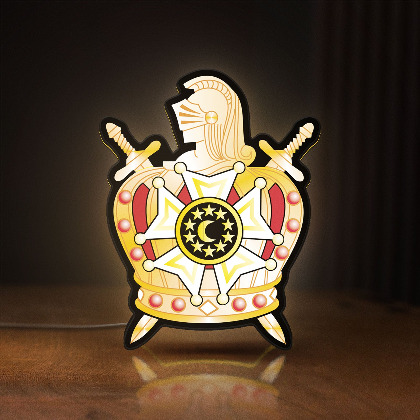 Front view of Ordem Demolay LED lightbox sign glowing on a wooden desk