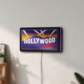 Unlit Hollywood Video LED lightbox mounted on a wall in daylight