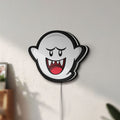 Unlit Boo LED lightbox mounted on a wall in daylight