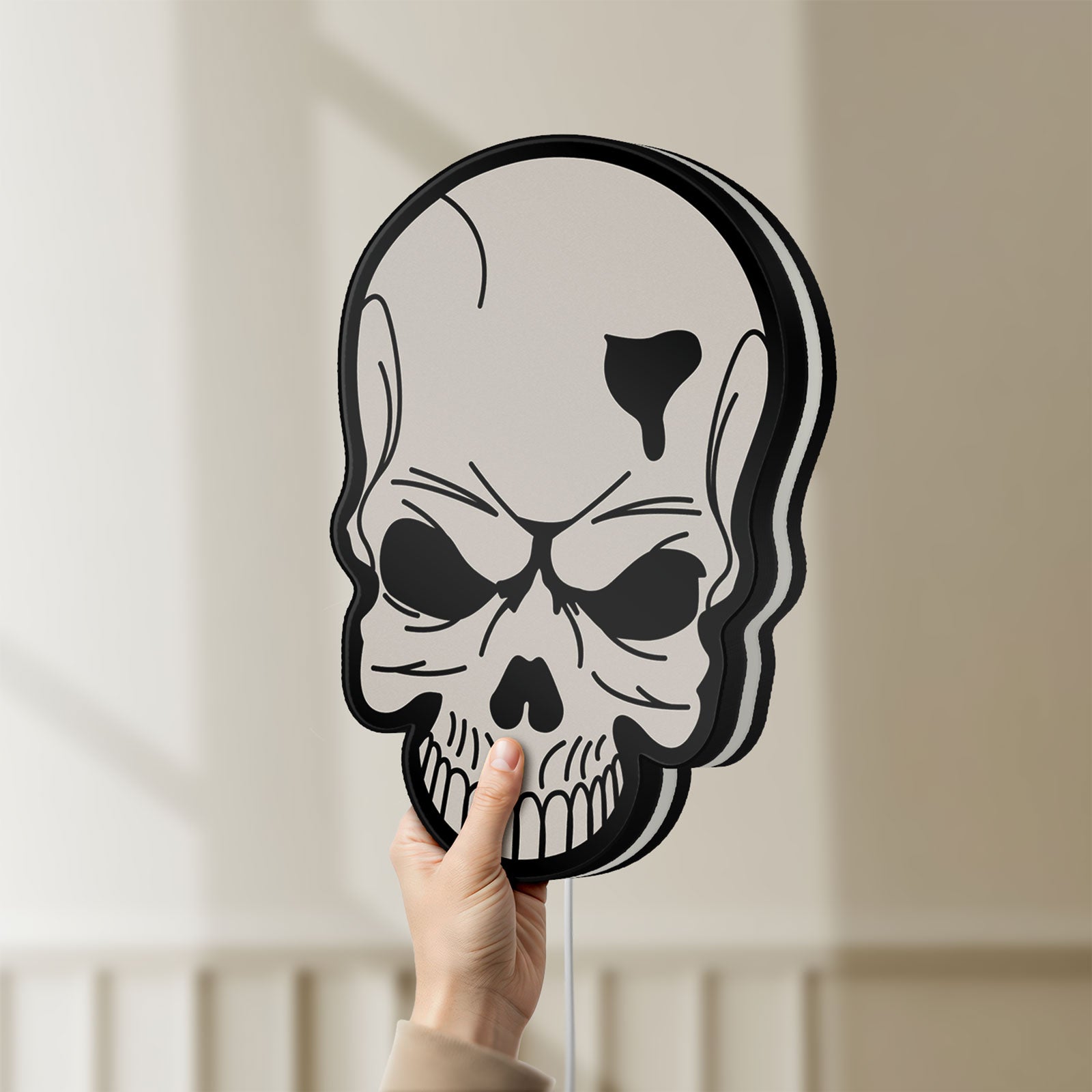 Unlit Skull LED lightbox held by hand to show size and details