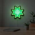 Selamat Idulfitri LED lightbox hanging on a room wall with soft yellow light