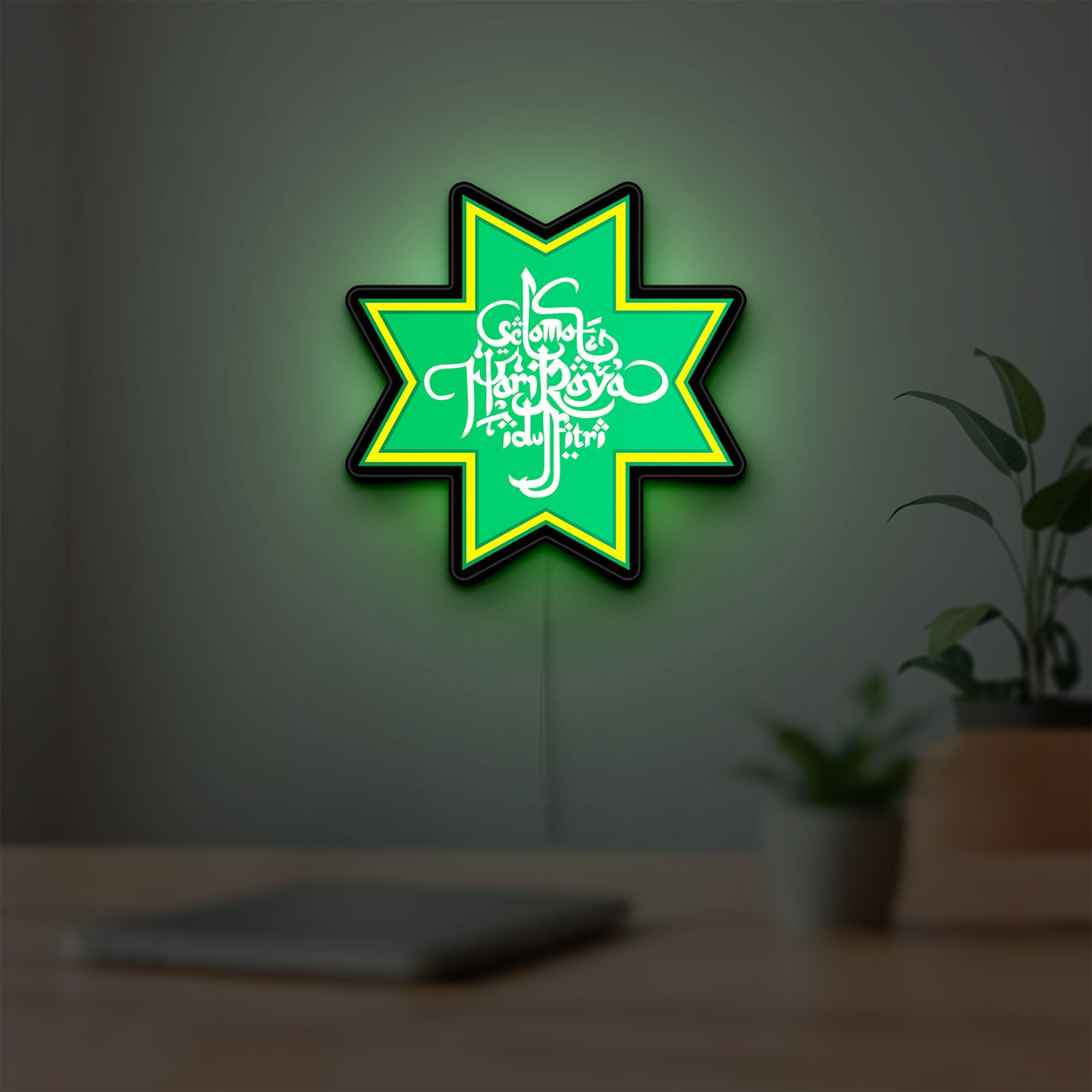 Selamat Idulfitri LED lightbox hanging on a room wall with soft yellow light