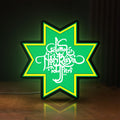Front view of Selamat Idulfitri LED lightbox sign glowing on a wooden desk