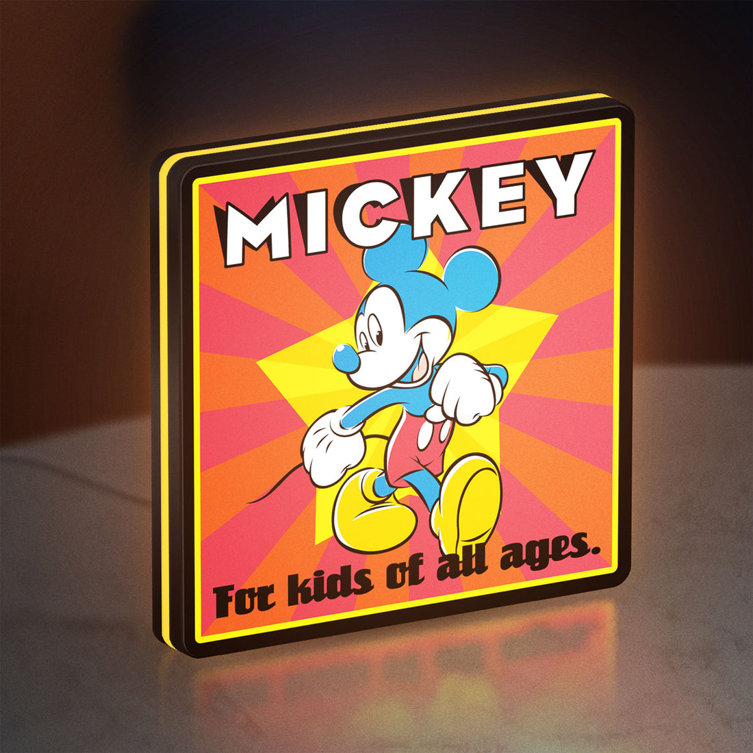 Mickey Mouse LED lightbox hanging on a wall with yellow glow
