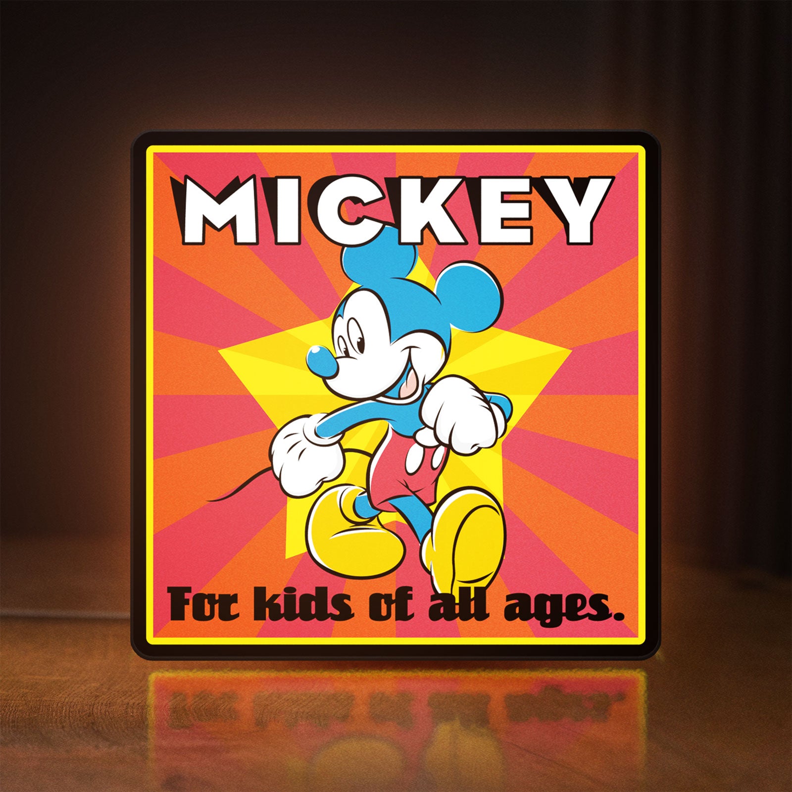 Front view of Mickey Mouse LED lightbox sign glowing on a wooden desk