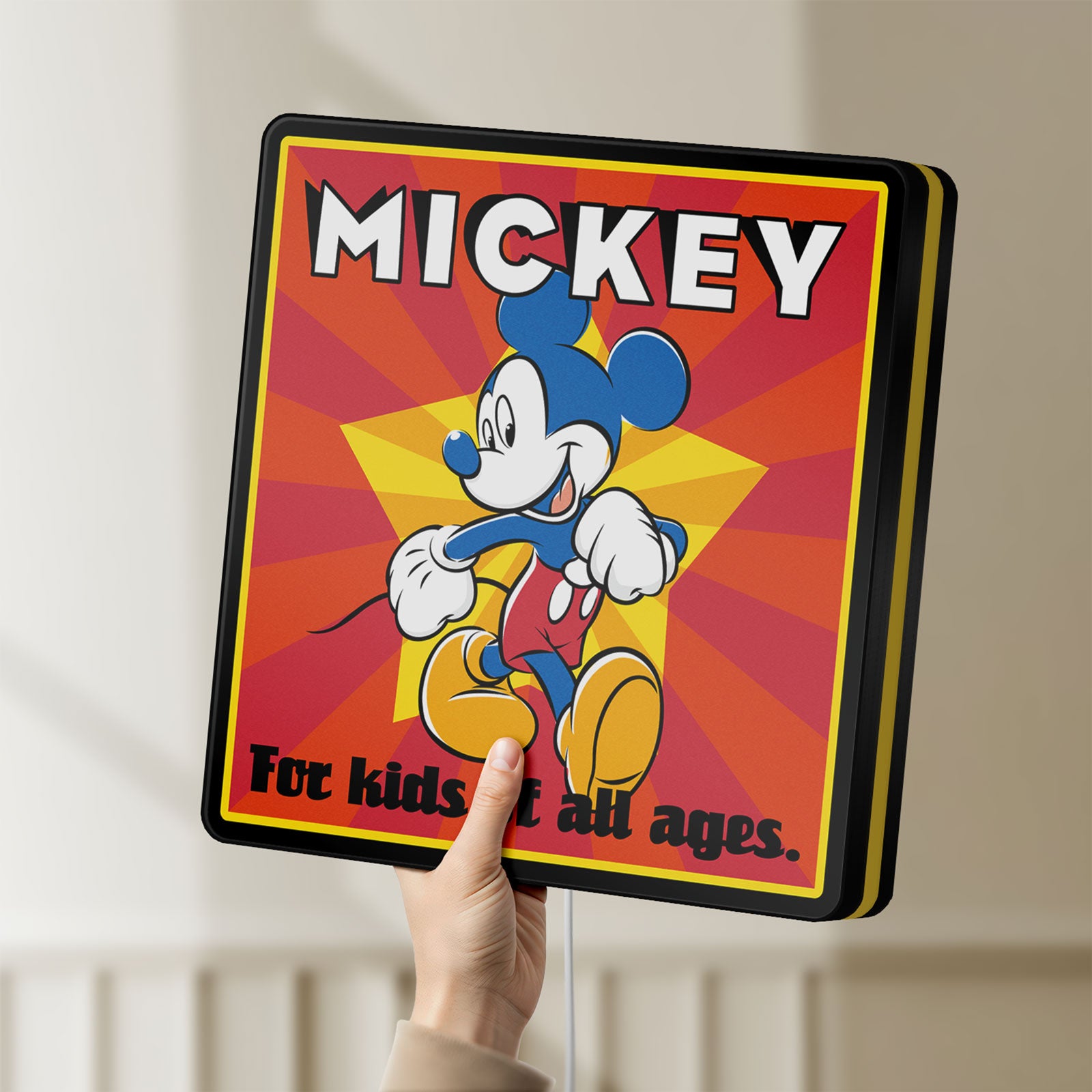 Unlit Mickey Mouse LED lightbox held by hand to show size and details