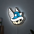 Blue Shell LED lightbox hanging on a wall with white glow