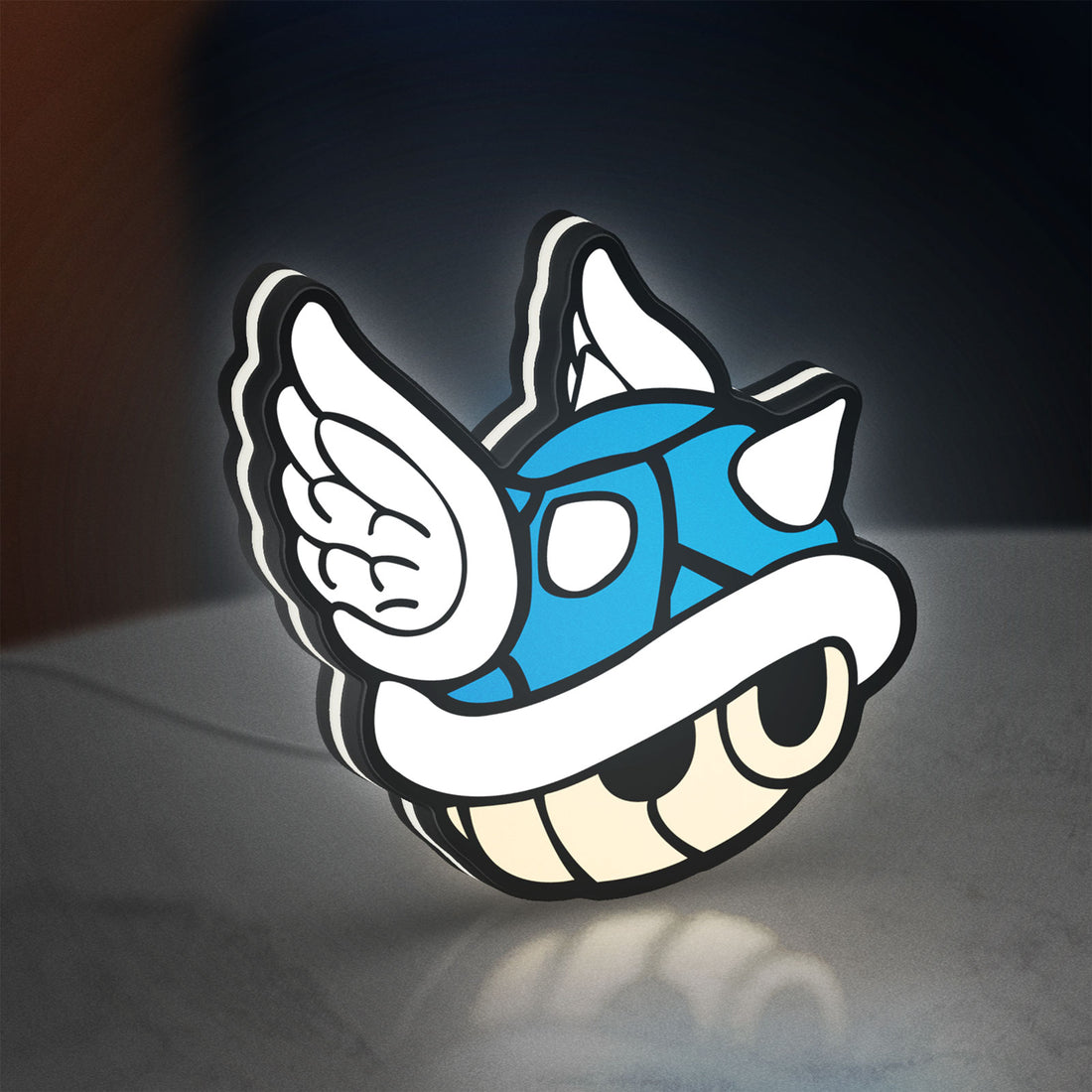 Blue Shell LED lightbox hanging on a wall with white glow