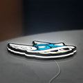 Blue Shell LED lightbox lying flat on a desk with white glow