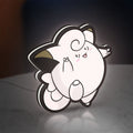 Clefairy LED lightbox standing on a desk from an angled side view with white glow