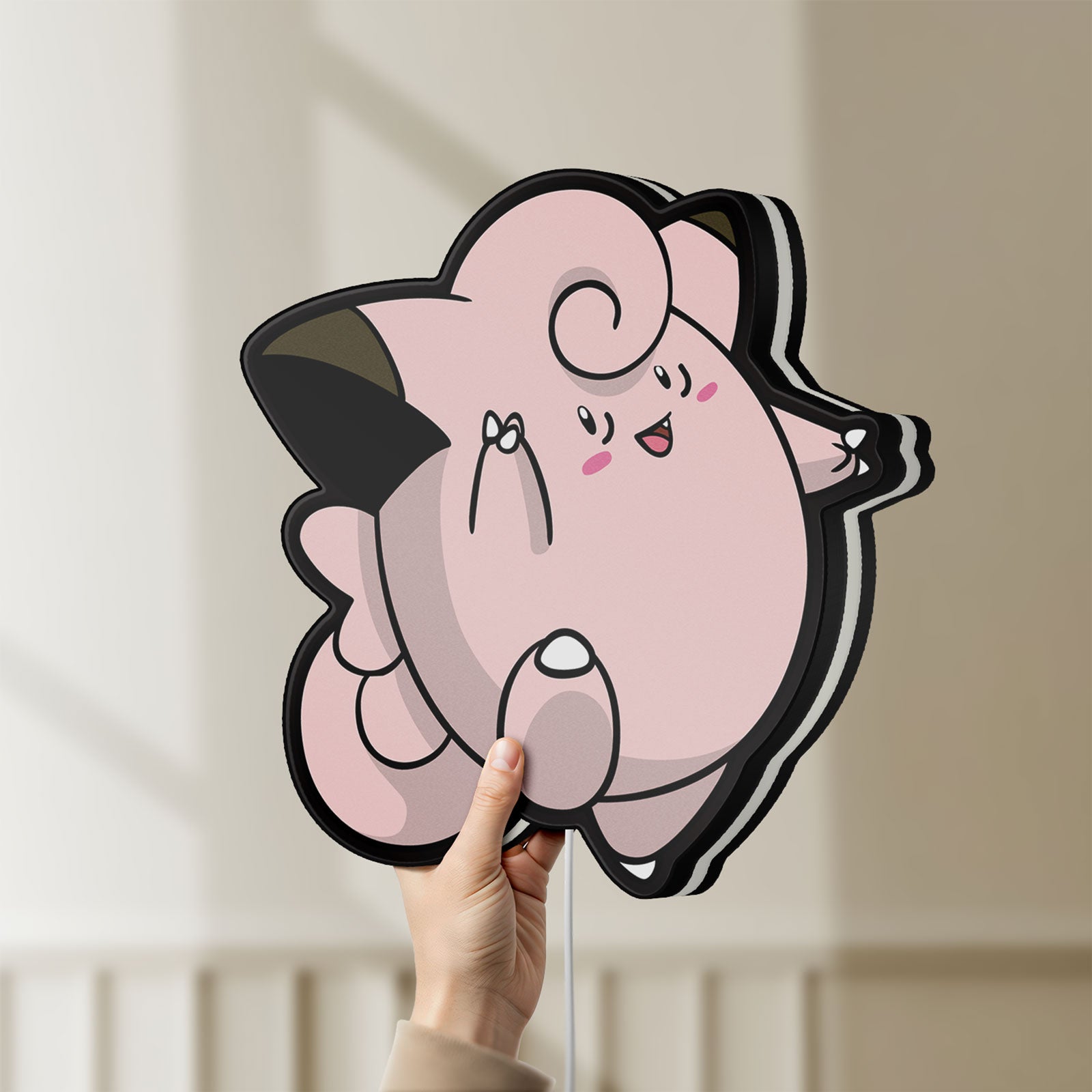 Unlit Clefairy LED lightbox held by hand to show size and details