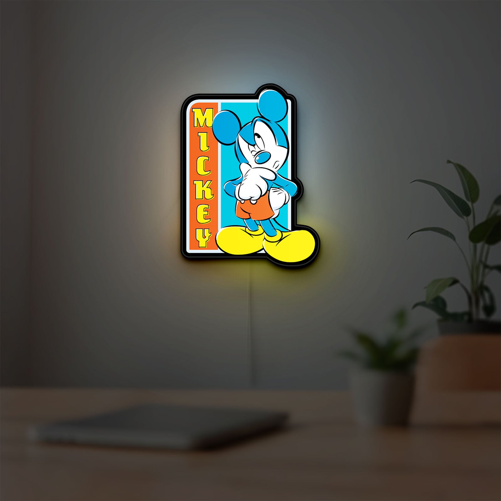 Mickey Mouse LED lightbox hanging on a room wall with soft yellow light
