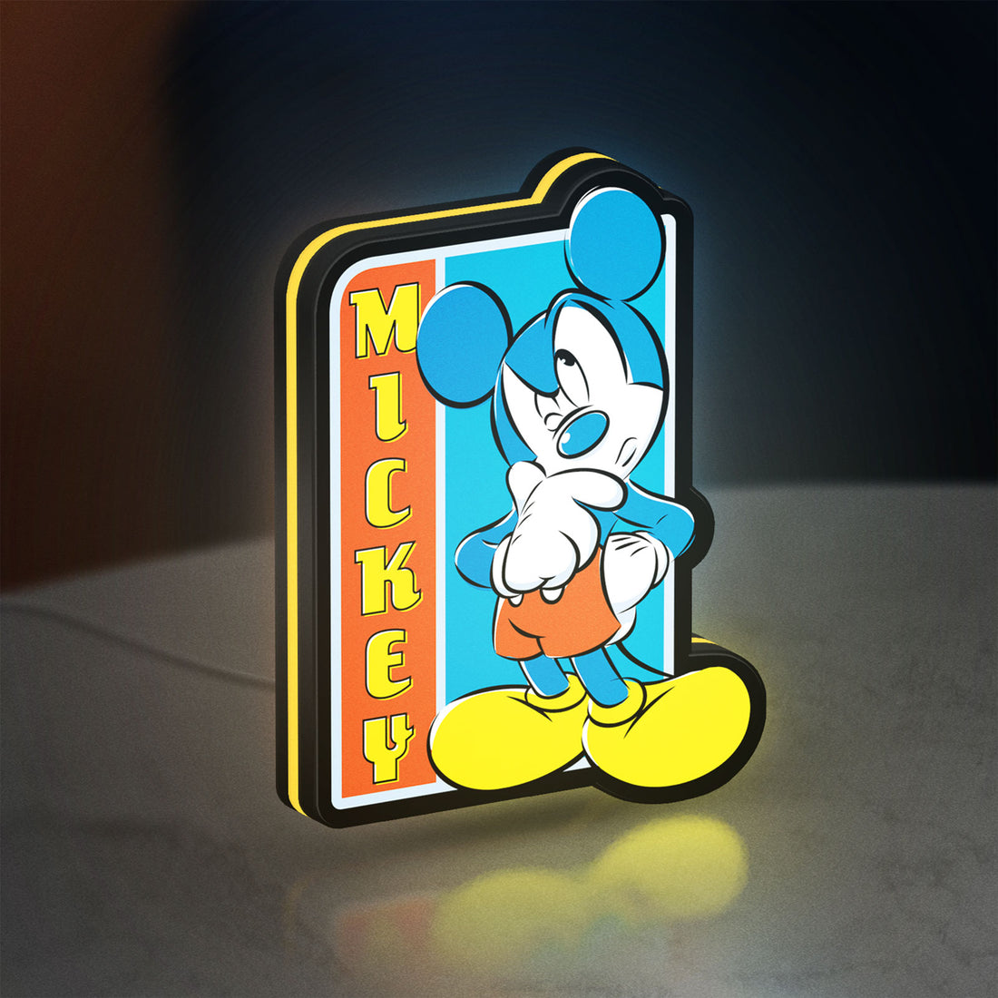 Mickey Mouse LED lightbox hanging on a wall with yellow glow