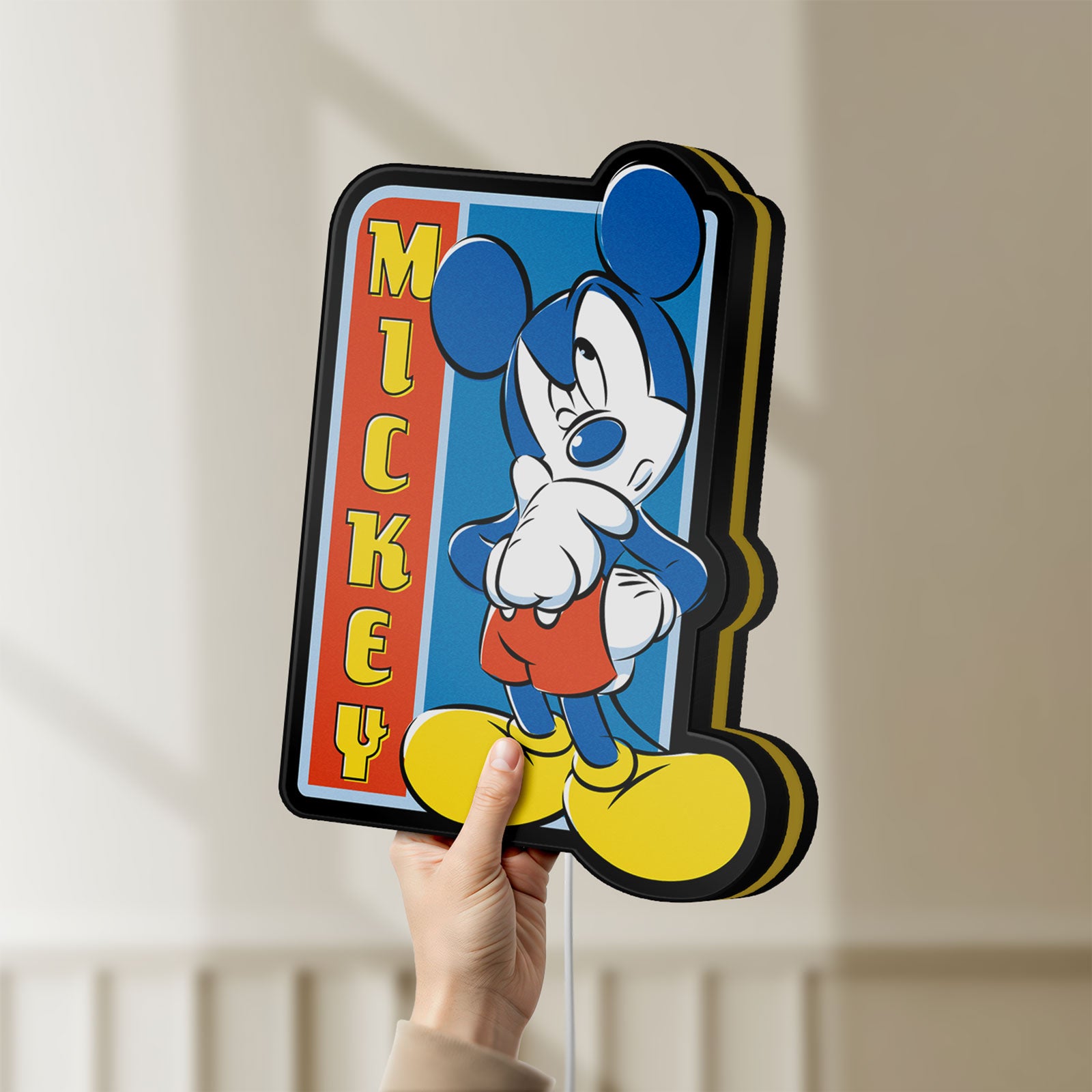 Unlit Mickey Mouse LED lightbox held by hand to show size and details